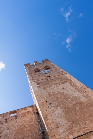 Very old tower in in small Spanish town with clockの写真素材