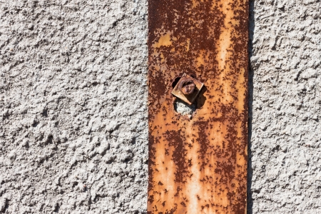Rusty metal on vintage plaster concrete wall wallpaper backgroundの写真素材
