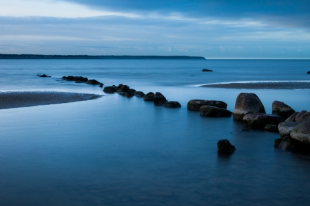 View of a rocky coast in the morning. Long exposure shot.の写真素材