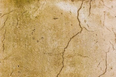 Grunge cracked plaster stone wall background.の写真素材