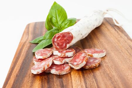 Culinary traditional spanish sausages with peppercorns on wooden textured backgroundの写真素材