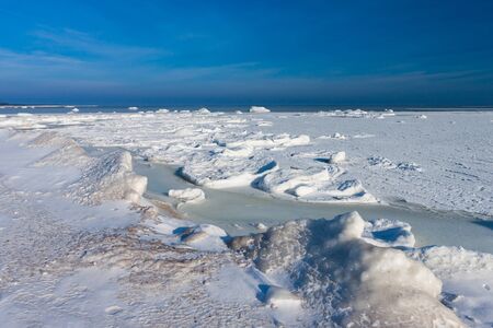 Frozen winter Baltic sea under snow during sunny day  Estonia の写真素材