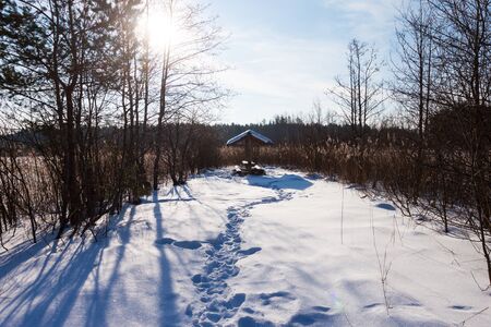 Winter pond summer house under snow