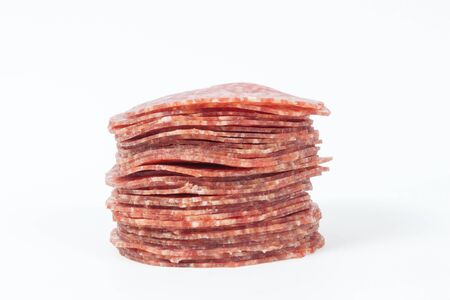slices of salami isolated on a white backgroundの写真素材