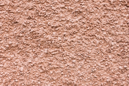 Painted pebble stones texture wall backgroundの写真素材