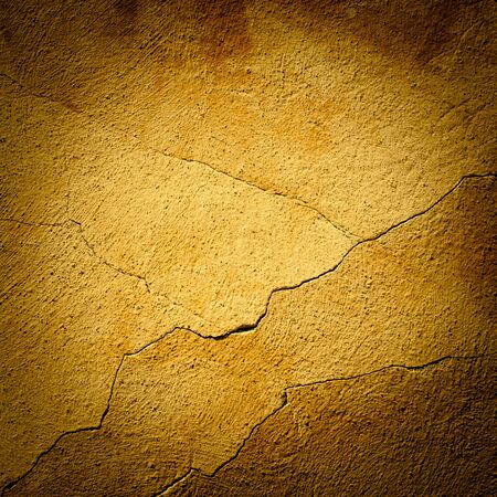 Background made with a texture of a yellow wallの写真素材
