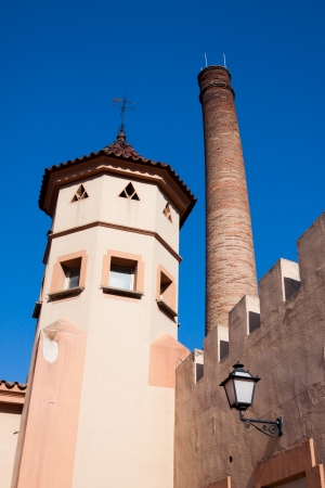 Old tower chimney and lantern on the wall in Spainの写真素材