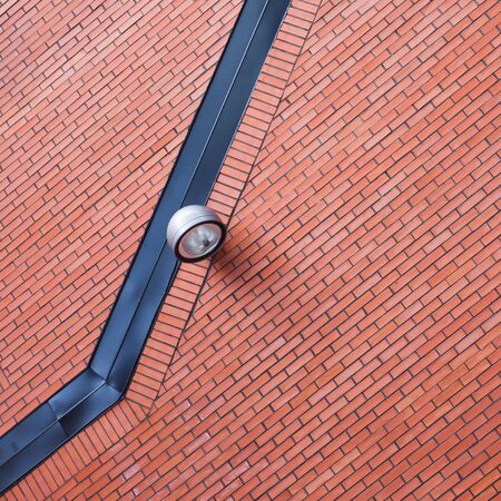 lantern on the red tiles wallの写真素材