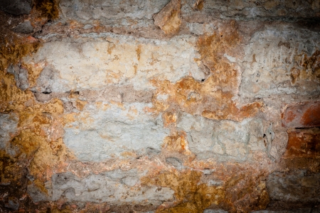 Rusty vintage stone wall texture backgroundの写真素材