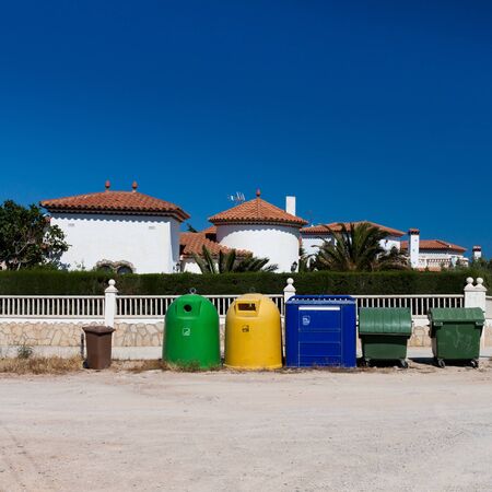 colored garbage bins to help separate and recycle