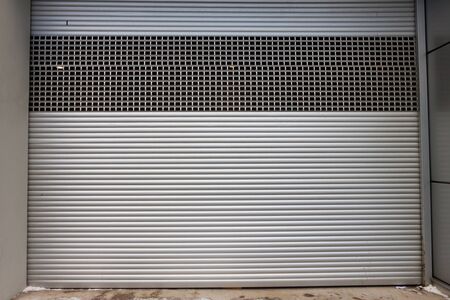 Building with metal roller shutter doorの写真素材