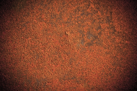 Dark edged old rusty iron metal plate backgroundの写真素材