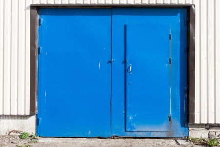 shut and locked grunge metal doorの写真素材