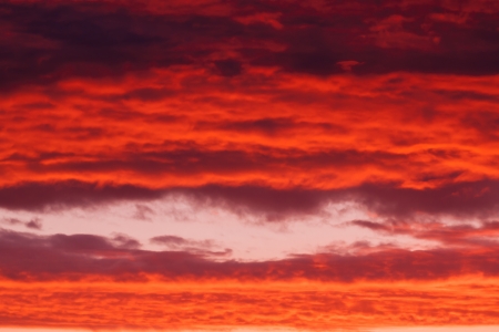 Bright vibrant sunset sky backgroundの写真素材
