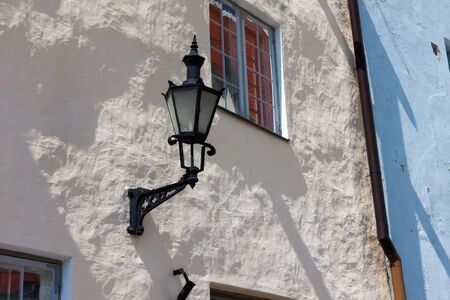 Old-fashioned lantern on the wallの写真素材