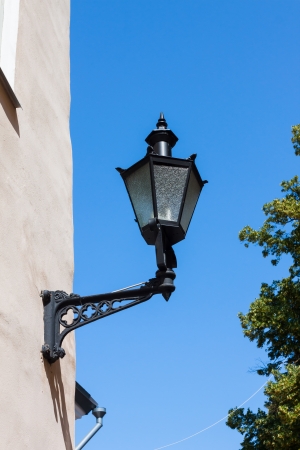 Old-fashioned lantern on the wallの写真素材