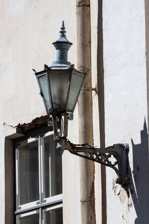 Old-fashioned lantern on the wallの写真素材