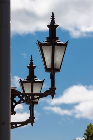 Old-fashioned lantern on the wallの写真素材