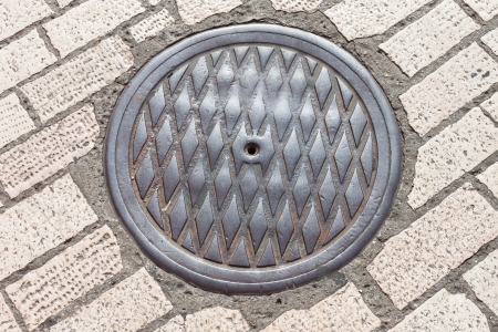 pavement & hatch sewer manhole (see more in portfolio)の写真素材