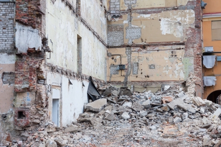 heap of rubble and a demolished building in the backgroundの写真素材