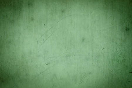 Grunge green background texture of a metall scratched wallの写真素材