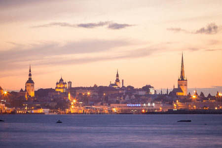 silhouette of tallinn with fire sea sunsetの写真素材