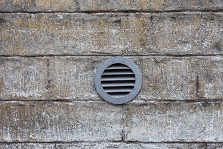 Ventilation system on an old stone wall