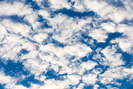 Blue sky background with a tiny clouds