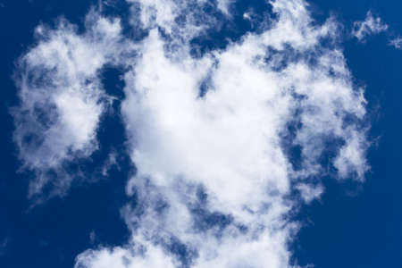 blue day sky background with white cloudsの写真素材