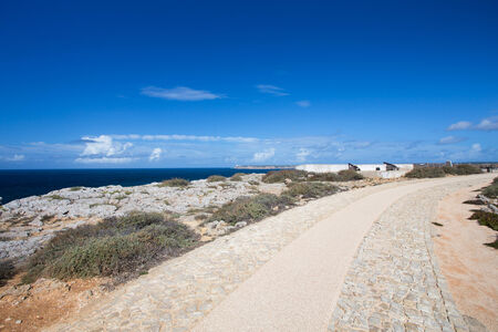 Two cannon in the fort of Sagres with the St Vincent cape at backgroundの写真素材