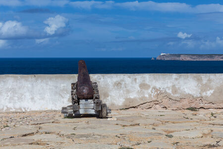 Cannon in the fort of Sagres with the St Vincent cape at backgroundの写真素材
