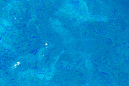 background texture of blue water in the pool