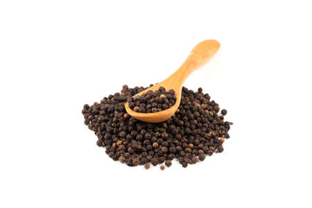 Black pepper with wood spoon isolated on the white background