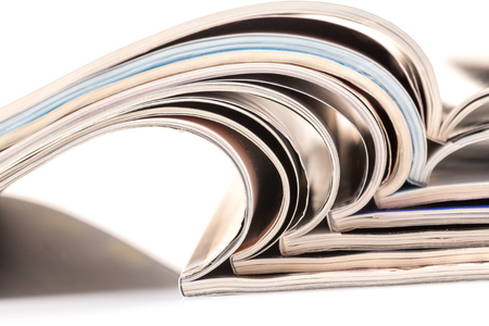 Stack of magazines on white background with reflectionの写真素材