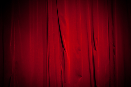 Curtain from the theater with a spotlight as backgroundの写真素材