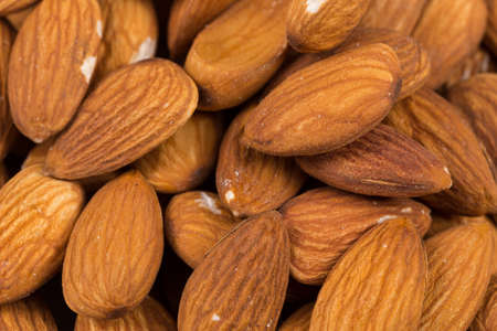 Composition from almond nuts background - macro shotの写真素材