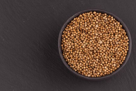 Close up of dried coriander seeds in a bowlの写真素材
