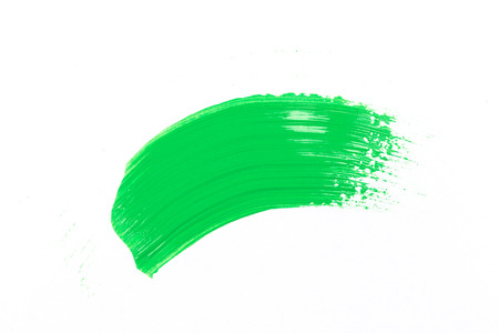 green stroke of the paint brush on white paperの写真素材
