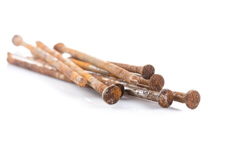some old rusty nails on white tableの写真素材