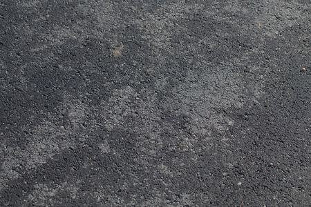 close-up horizontal view of new asphalt roadの写真素材