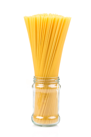 Uncooked pasta spaghetti macaroni isolated on white backgroundの写真素材