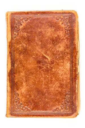 Old book leather cover isolated on white backgroundの写真素材
