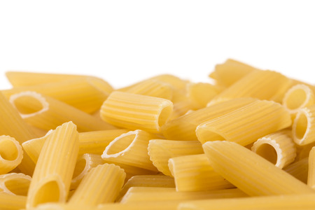 penne italian pasta isolated on white backgroundの写真素材