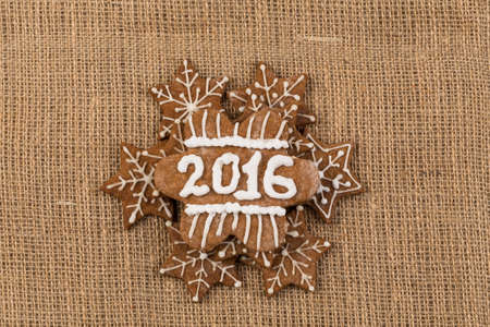 Christmas Gingerbread Cookies homemade with decoration on Sackcloth