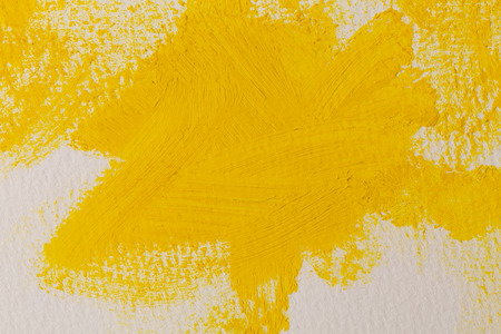 Close up of the yellow paint strokes textureの写真素材
