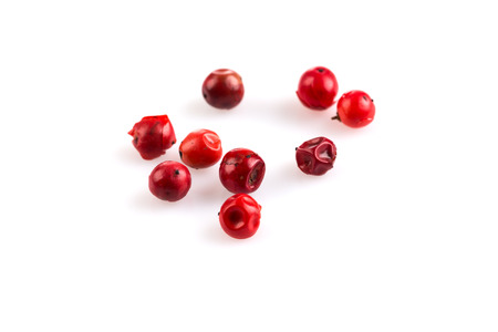 red peppercorns seeds isolated on white backgroundの写真素材