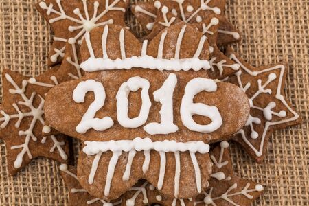 Christmas Gingerbread Cookies homemade with decoration on Sackcloth