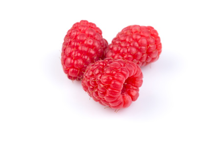 Fresh raspberries isolated on a white background