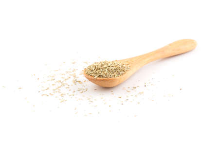 Dried rosemary leaves in wooden spoon over white background