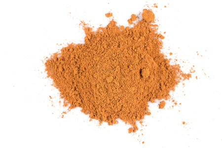 cinnamon  powder isolated on a white backgroundの写真素材